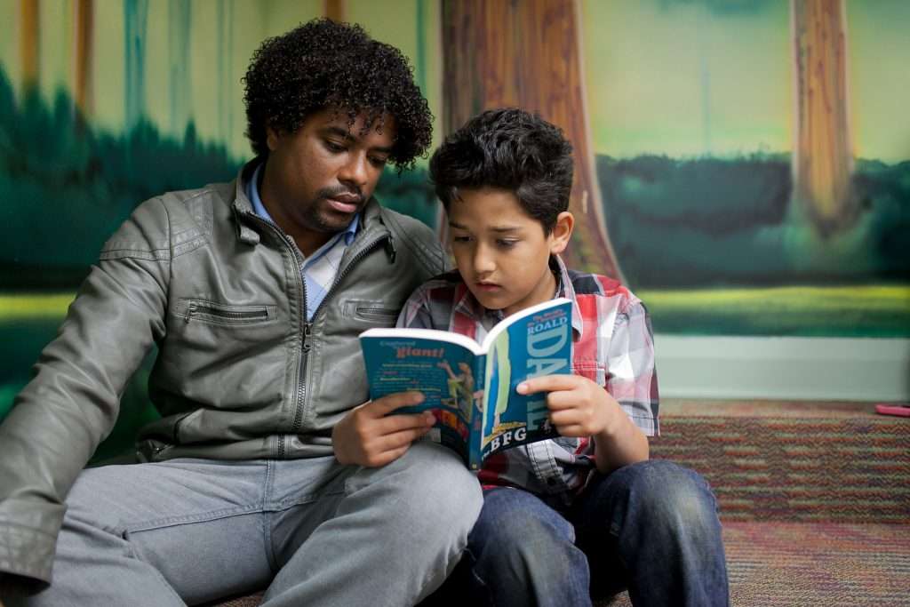 A man and child reading the BFG